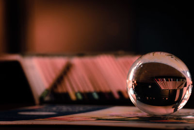 Close-up of crystal ball on table