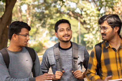 Group of young college students at campus, concept of youth friendship.