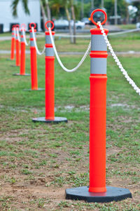 Close-up of red bell on field