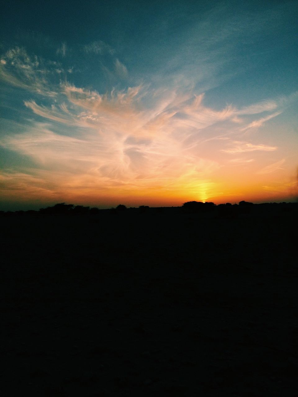 sunset, silhouette, scenics, tranquil scene, tranquility, beauty in nature, orange color, sky, landscape, idyllic, nature, dark, copy space, cloud - sky, outdoors, outline, cloud, dusk, horizon over land, dramatic sky