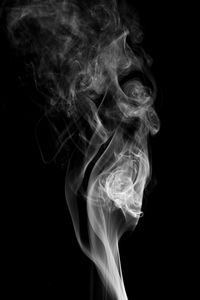 Close-up of smoke against black background