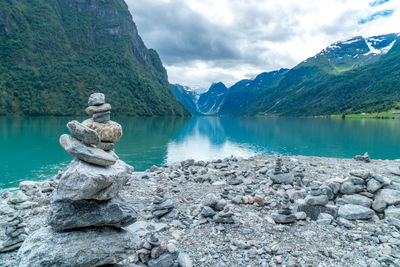 Scenic view of lake and mountains against sky