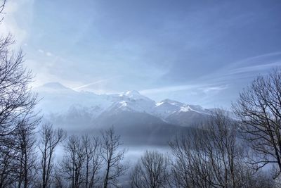 Scenic view of mountains against sky during winter