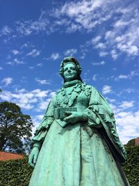 Low angle view of statue against cloudy sky