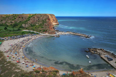 Scenic view of sea against clear blue sky