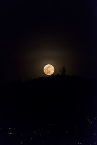 Silhouette moon against sky at night