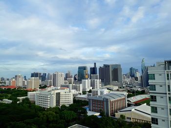 Modern buildings in city against sky