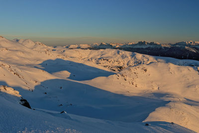 Scenic view of mountains against clear blue sky