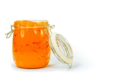 Close-up of drink in glass jar on white background