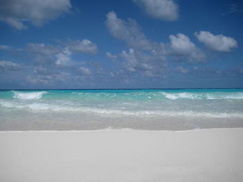 Scenic view of sea against blue sky