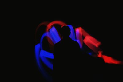 Close-up of person hand against black background