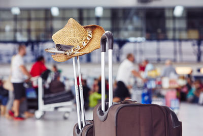 Hat on luggage at airport