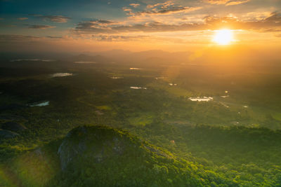 Scenic view of landscape against sky during sunset