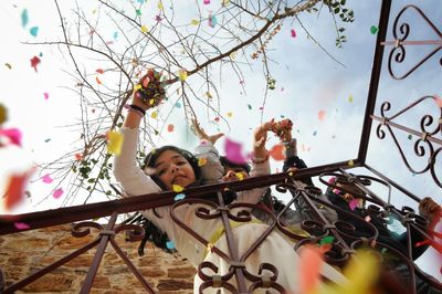 Low angle view of child playing on playground