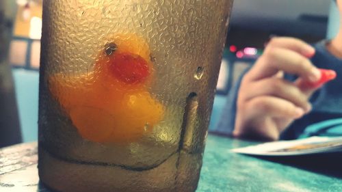 Close-up of hand holding drink