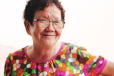 Close-up portrait of smiling senior woman