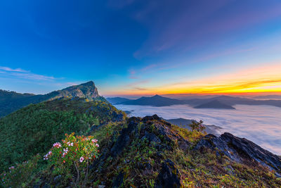 Scenic view of mountains against sky during sunset