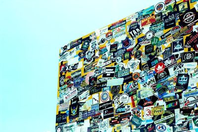 Low angle view of information sign against clear blue sky