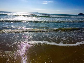 View of seascape against blue sky