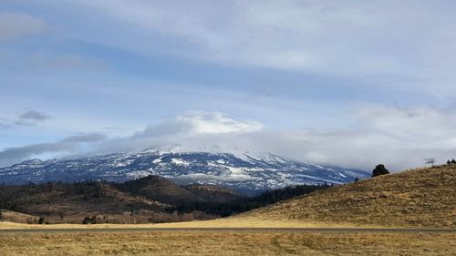 Scenic view of snowcapped mountains against sky