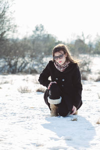 Portrait of a young woman in snow