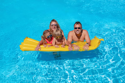 High angle view of woman swimming in pool