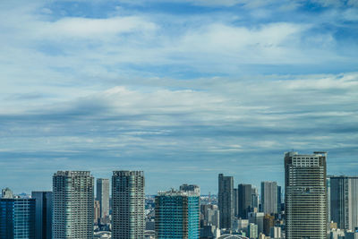 Buildings in city against sky