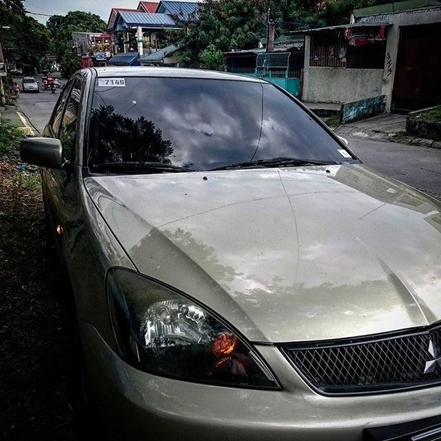 transportation, mode of transport, car, land vehicle, side-view mirror, vehicle interior, travel, on the move, part of, car interior, windshield, street, glass - material, road, cropped, transparent, reflection, air vehicle, headlight, vehicle part