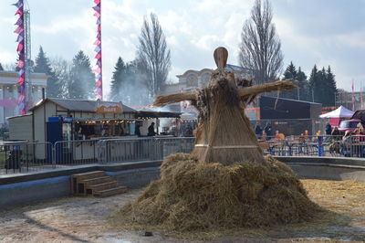 Panoramic shot of sculpture by building against sky