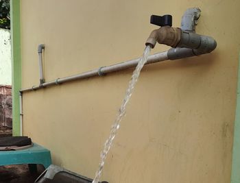 Close-up of water pipe against wall