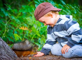 Portrait of boy sitting outdoors