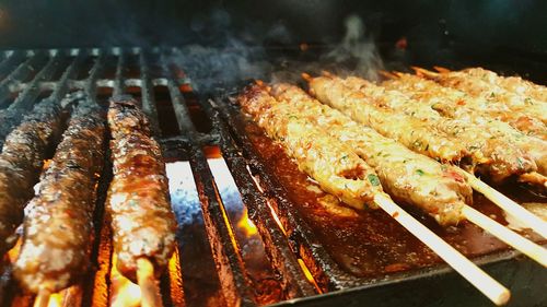 Close-up of meat on barbecue grill