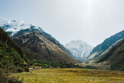 Laguna humantay with snow covered mountains in the background