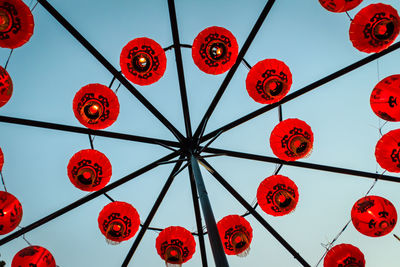 Low angle view of lantern against sky