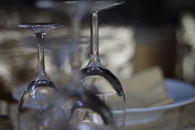 Close-up of empty wine glasses on table
