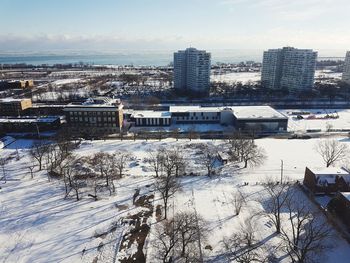 Cityscape against sky during winter