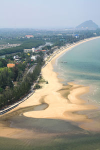 High angle view of sea and buildings against sky