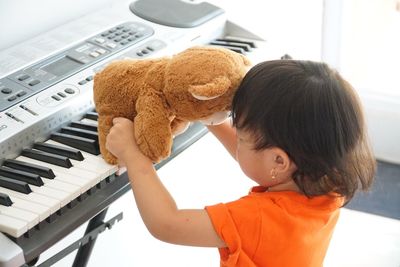 Close-up of boy playing with toy