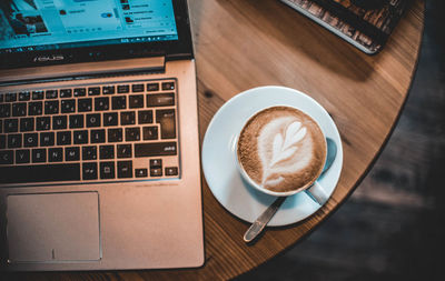 High angle view of coffee cup on table