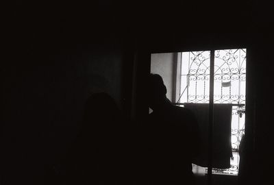 Silhouette woman at home