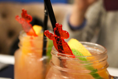 Close-up of orange fruit on glass table