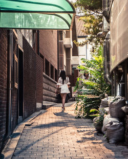 People walking in front of building