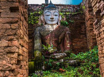 Statue against temple