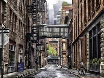 Alley amidst buildings in city