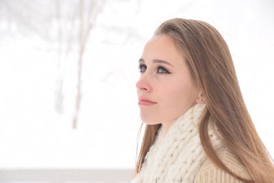 Teenage girl looking away during winter