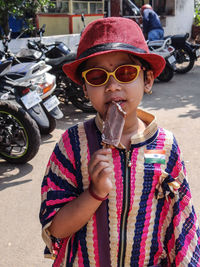 Portrait of young girl holding ice cream cone
