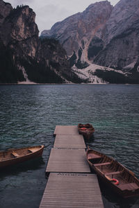 Pier over lake against mountain