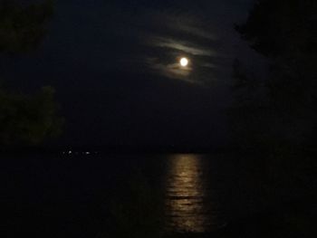 Scenic view of sea against sky at night