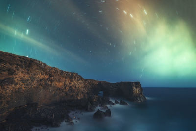 Scenic view of sea against sky at night