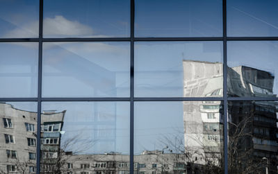 Low angle view of modern buildings against sky